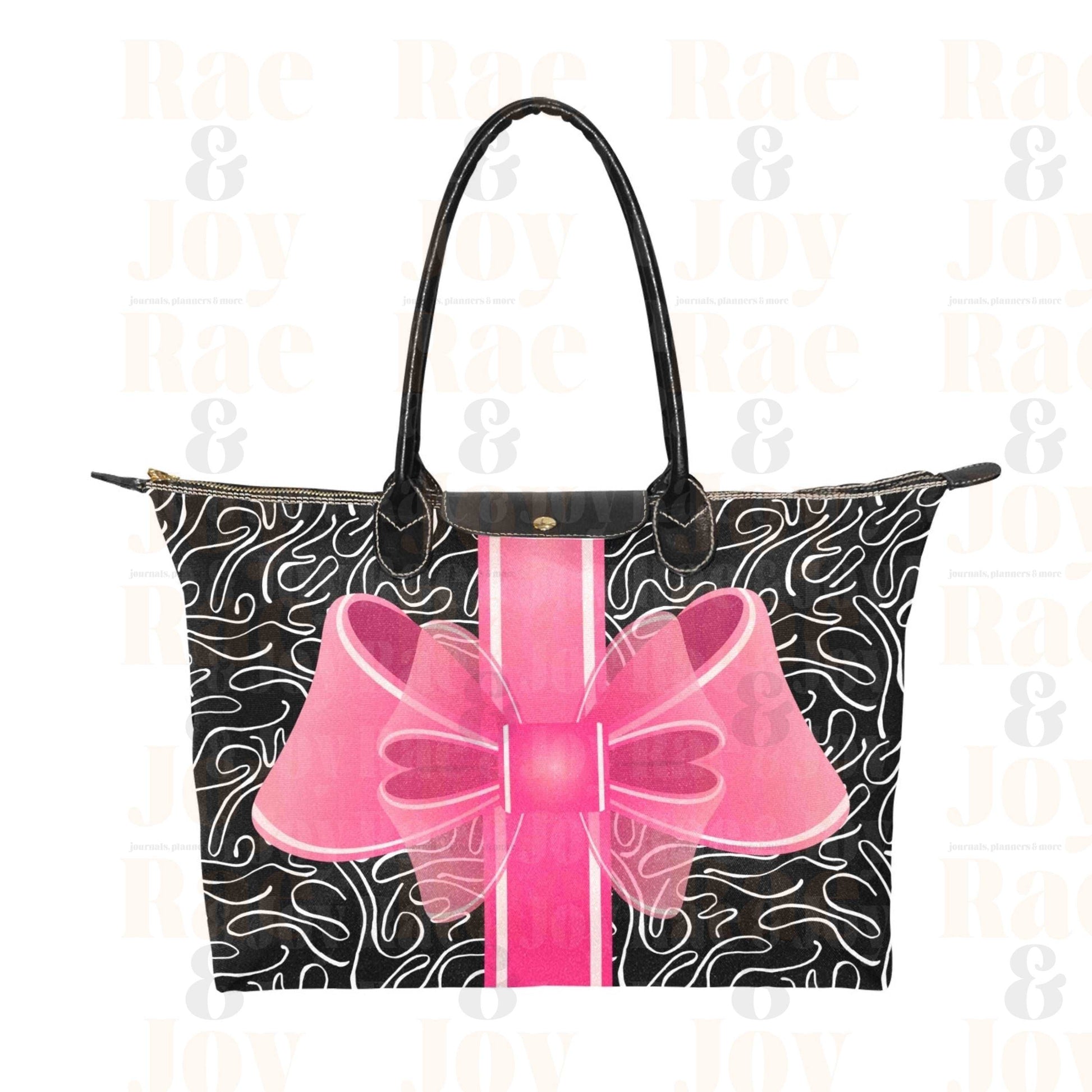 Zip top fashion tote bag with a big pink bow on a black with white abstract background.